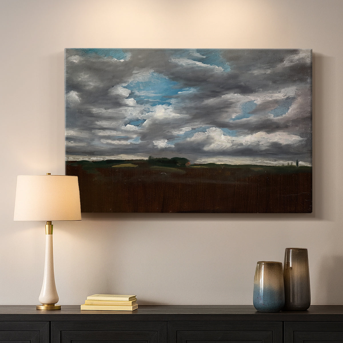 Canvas art print detailing a landscape emphasizing mood, mounted in a softly lit interior space