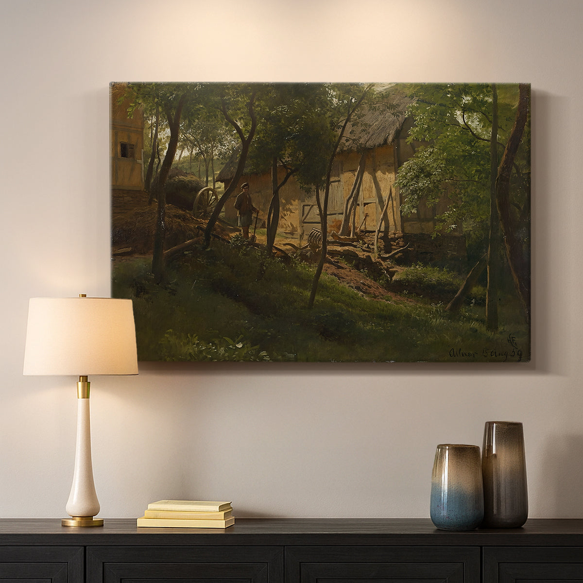 Canvas art print detailing a rural composition with buildings nestled among greenery, mounted in a softly lit interior space