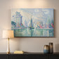 Canvas art print detailing a coastal composition with buildings, mounted in a softly lit interior space
