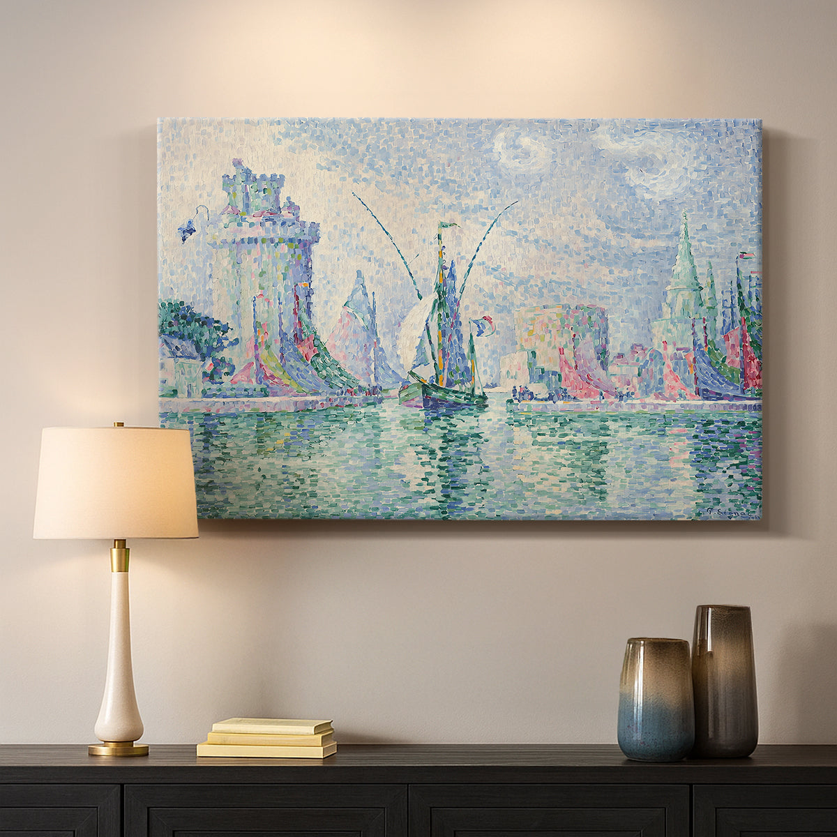Canvas art print detailing a coastal composition with buildings, mounted in a softly lit interior space