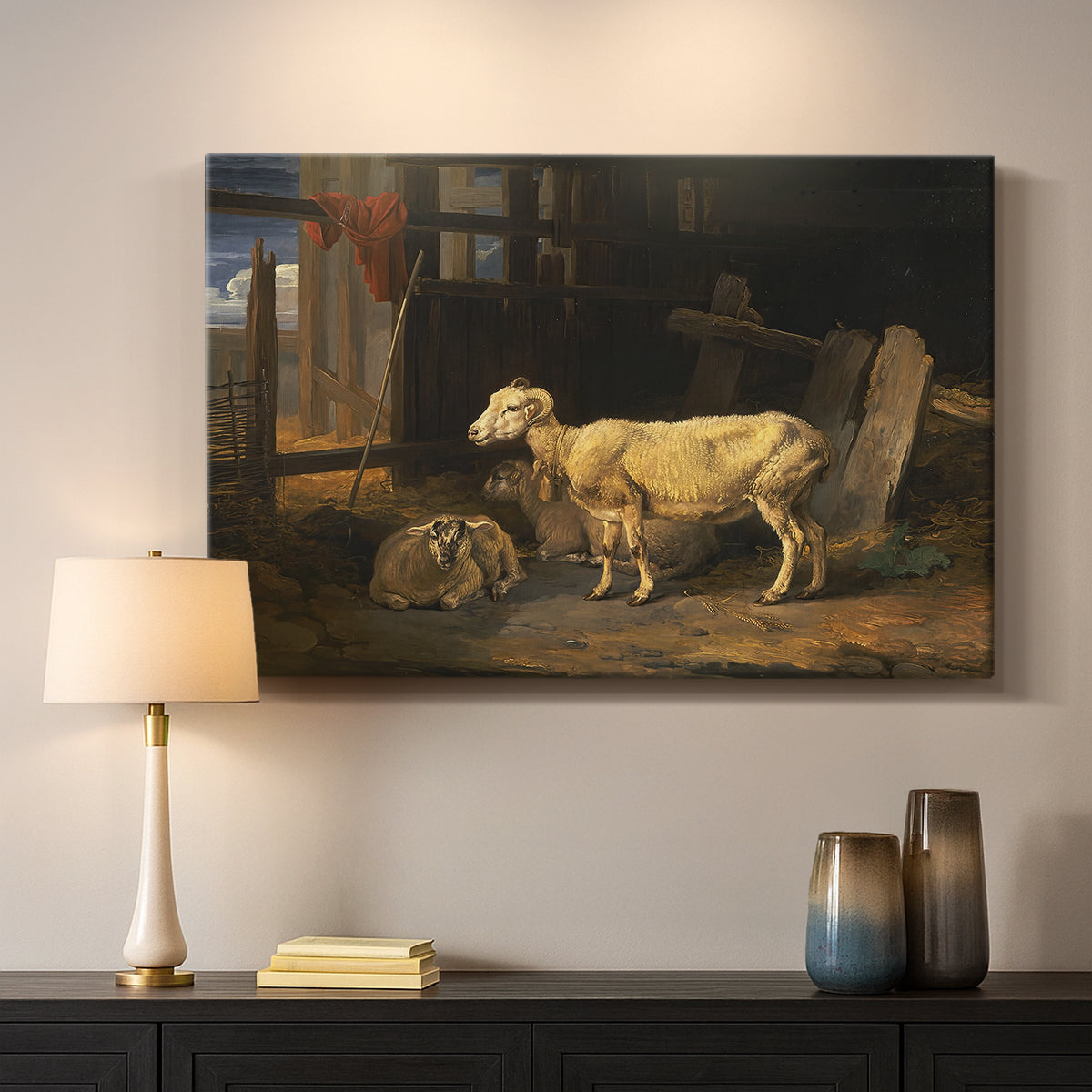 Canvas art print detailing a pastoral depiction of livestock inside barn, mounted in a softly lit interior space