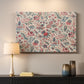 Canvas art print detailing a textile-style artwork with repeating botanical motifs, mounted in a softly lit interior space
