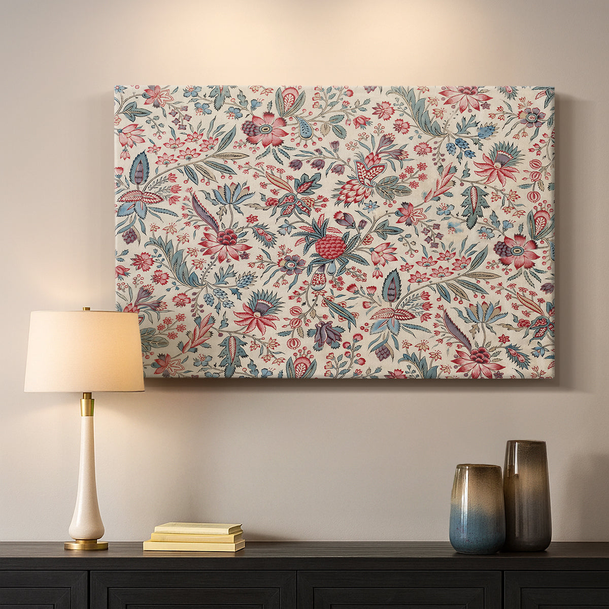 Canvas art print detailing a textile-style artwork with repeating botanical motifs, mounted in a softly lit interior space