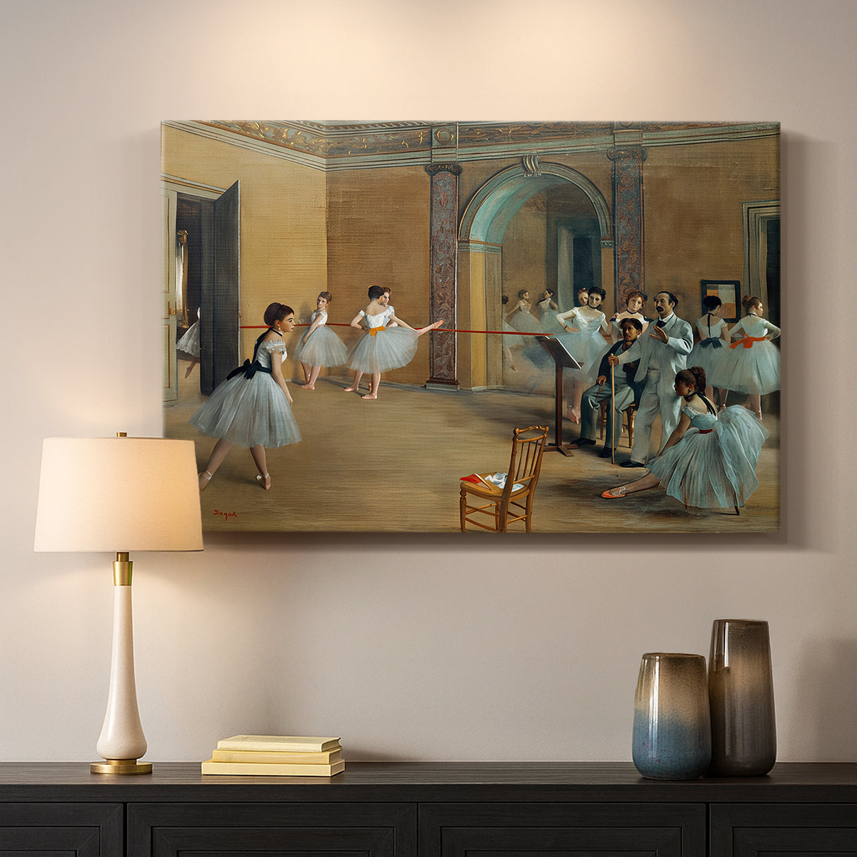 Canvas art print detailing an elegant rehearsal space with dancers in soft lighting, mounted in a softly lit interior space