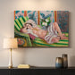 Canvas art print detailing a stylized odalisque in a richly ornamented interior, mounted in a softly lit interior space