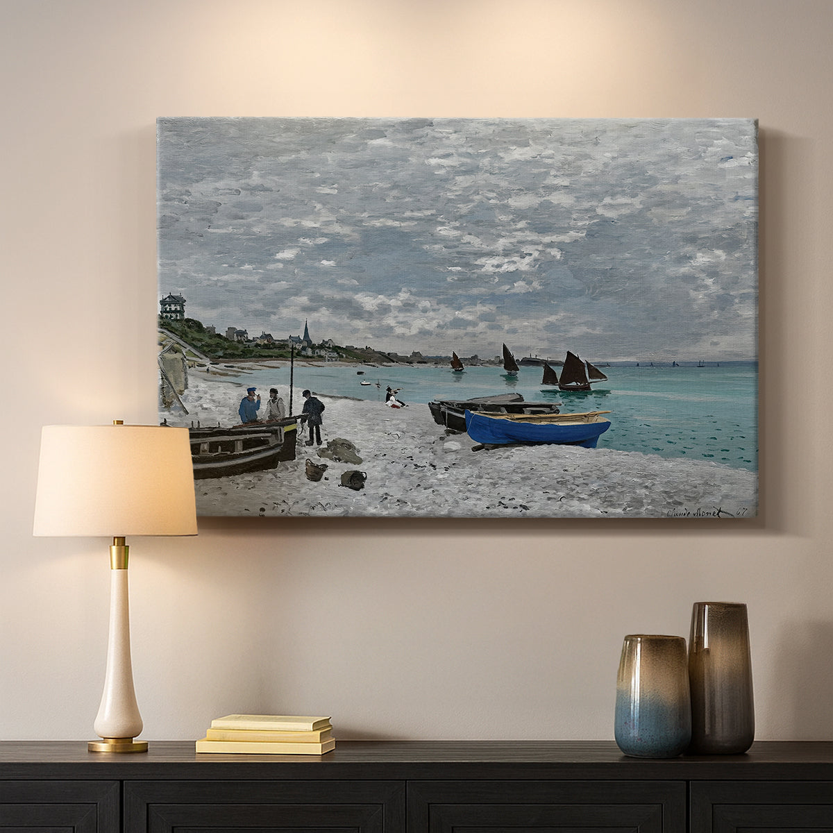 Canvas art print detailing an impressionist seaside gathering with flags and ocean view, mounted in a softly lit interior space