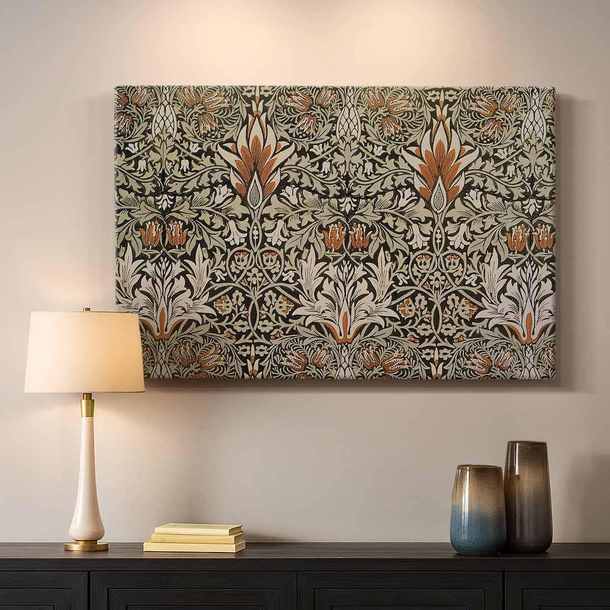 Canvas art print detailing a botanical motif with repeating curved stems on dark ground, mounted in a softly lit interior space
