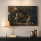 Canvas art print detailing a detailed outdoor scene of man with dogs, mounted in a softly lit interior space