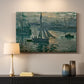 Canvas art print detailing an atmospheric ocean view with sun rising through haze, mounted in a softly lit interior space