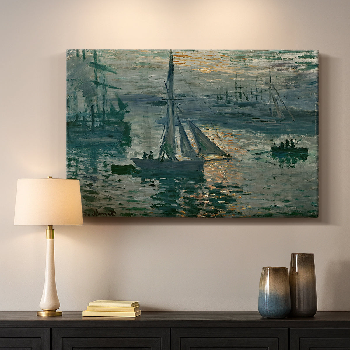 Canvas art print detailing an atmospheric ocean view with sun rising through haze, mounted in a softly lit interior space