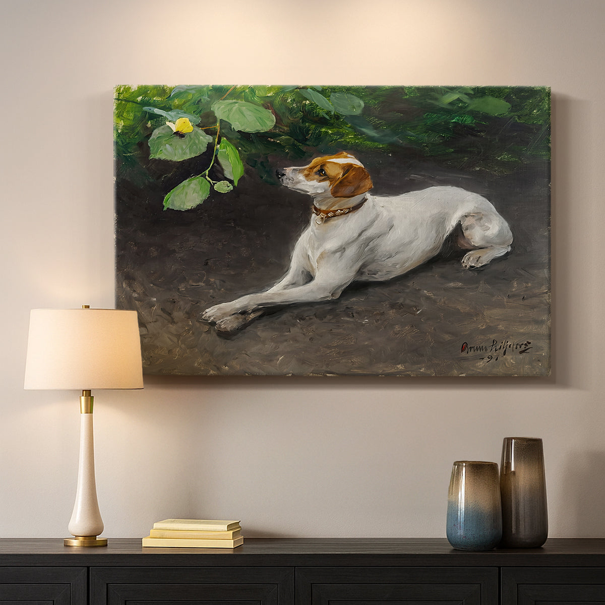 Canvas art print detailing a calm scene of dog reclining in open landscape, mounted in a softly lit interior space