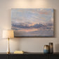 Canvas art print detailing a landscape focused on cloud formations, mounted in a softly lit interior space