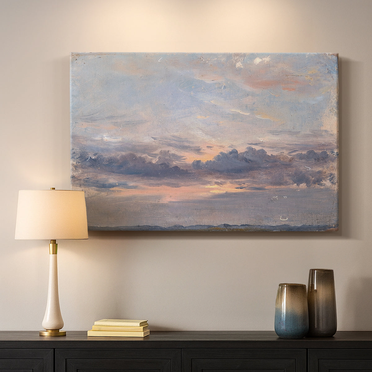 Canvas art print detailing a landscape focused on cloud formations, mounted in a softly lit interior space
