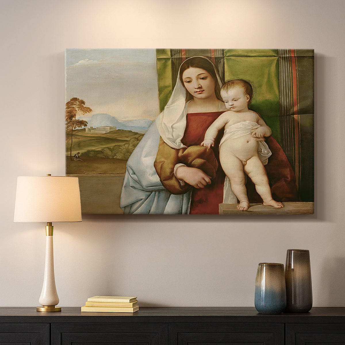 Canvas art print detailing a devotional image with seated woman and infant in quiet outdoor scene, mounted in a softly lit interior space