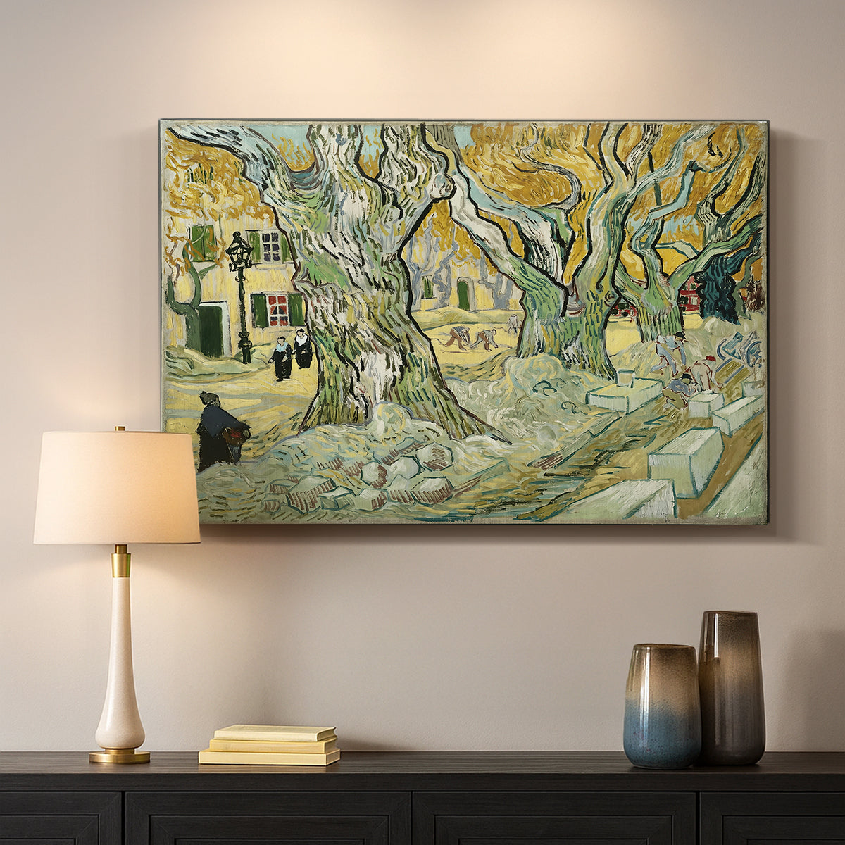 Canvas art print detailing a landscape featuring tall trunks and figures in shaded area, mounted in a softly lit interior space