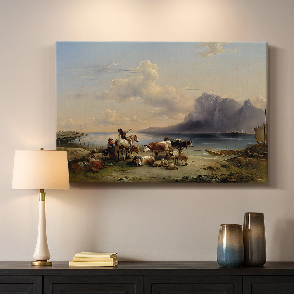 Canvas art print detailing a countryside composition with herd near lakeshore, mounted in a softly lit interior space