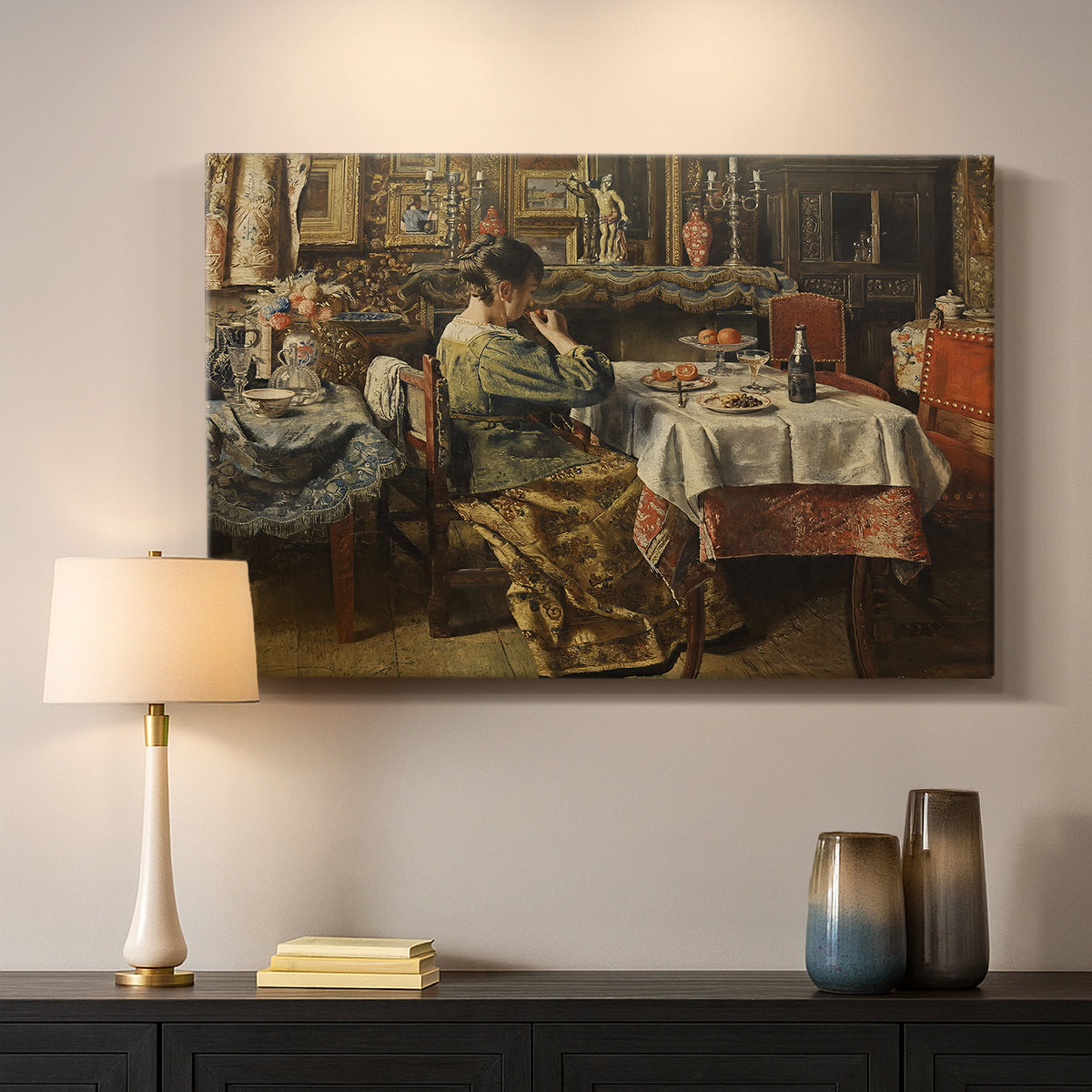 Canvas art print detailing an everyday life scene centered around communal meal, mounted in a softly lit interior space