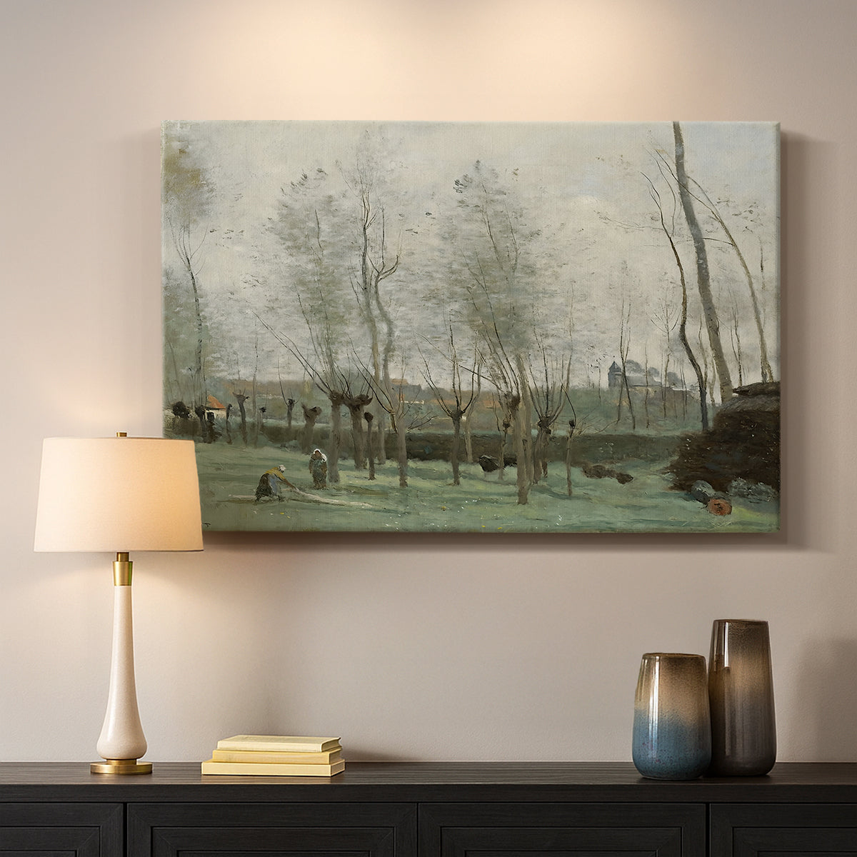 Canvas art print detailing a tranquil outdoor scene with washerwomen and foliage, mounted in a softly lit interior space