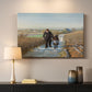 Canvas art print detailing a peaceful rural setting with elderly man and child, mounted in a softly lit interior space