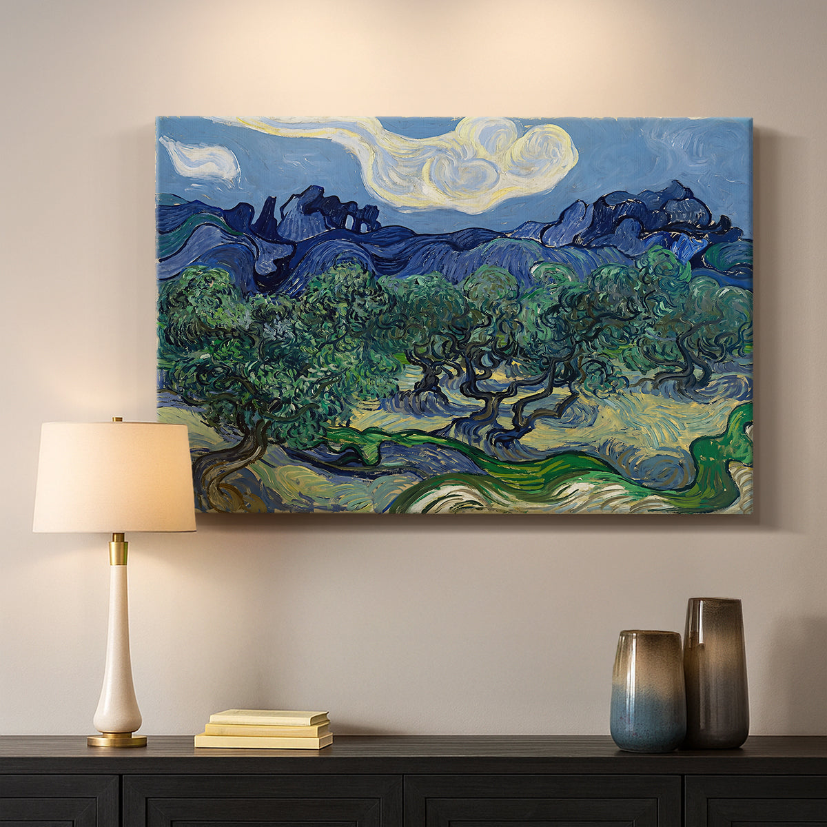 Canvas art print detailing a rural composition emphasizing contrast between trees and mountains, mounted in a softly lit interior space