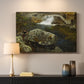 Canvas art print detailing a peaceful natural setting with mill and still water, mounted in a softly lit interior space