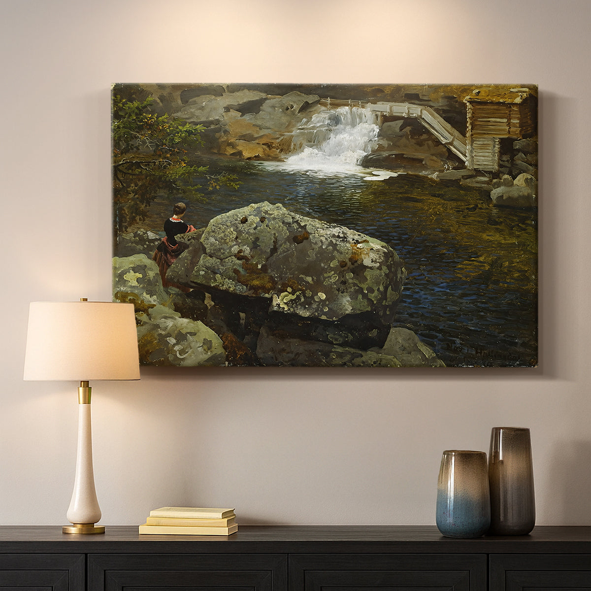 Canvas art print detailing a peaceful natural setting with mill and still water, mounted in a softly lit interior space