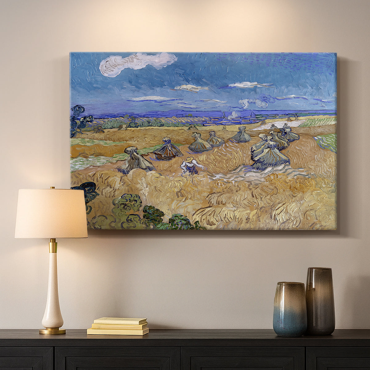 Canvas art print detailing a post-impressionist composition with field and worker, mounted in a softly lit interior space