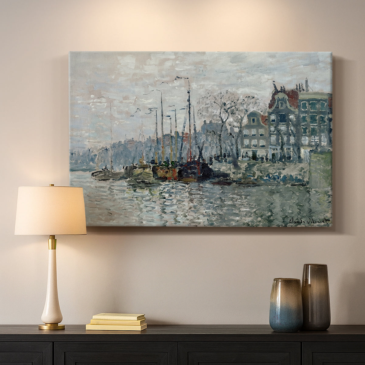 Canvas art print detailing a harbor view with masts, houses, and reflections in water, mounted in a softly lit interior space