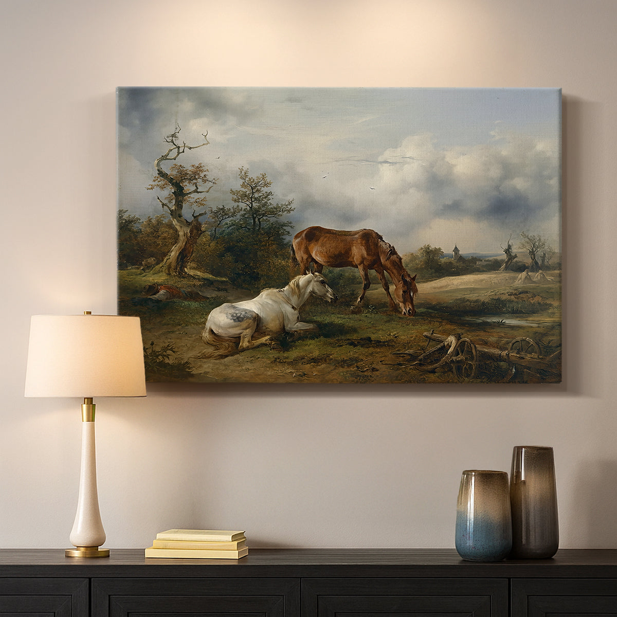 Canvas art print detailing a countryside composition with grazing animals, mounted in a softly lit interior space
