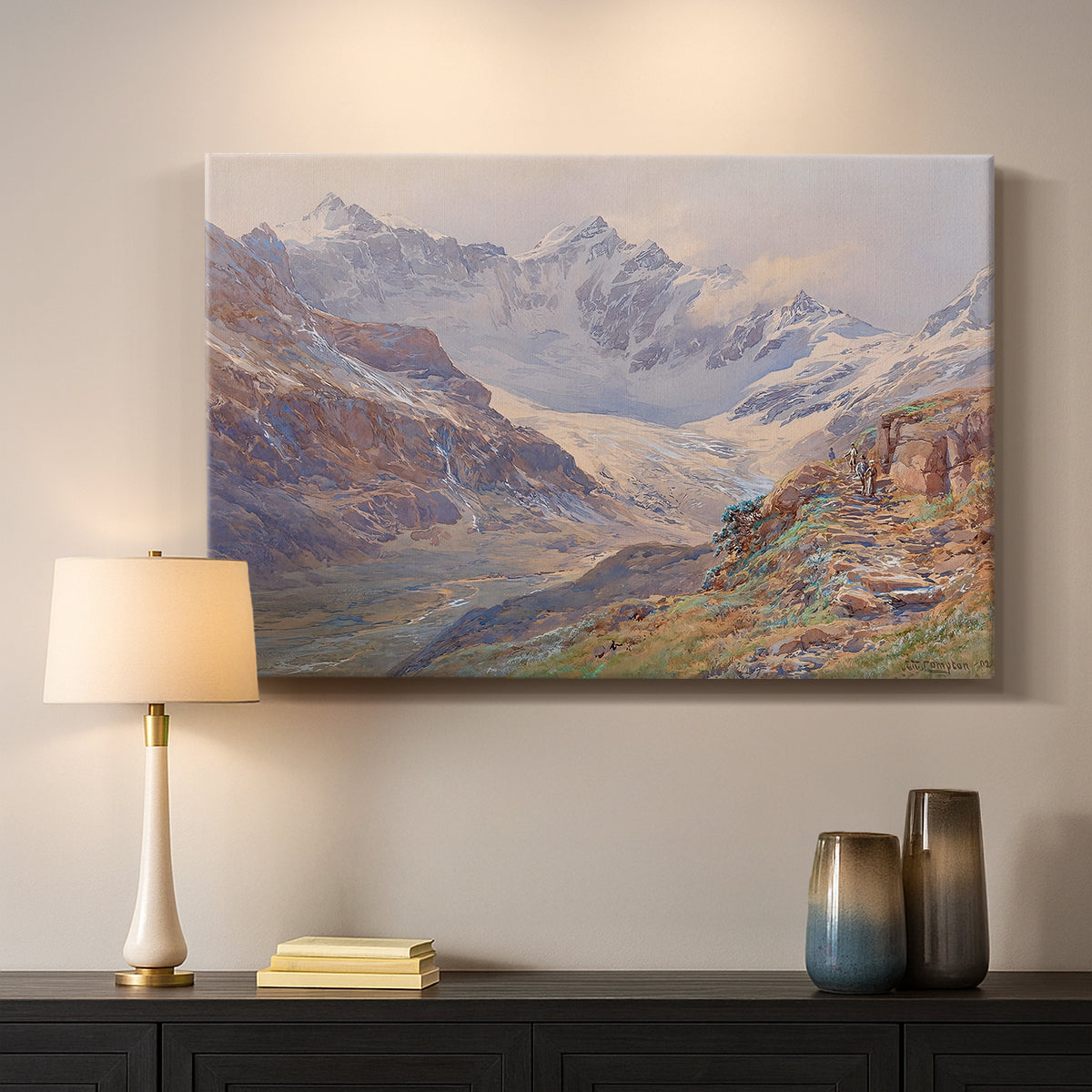Canvas art print detailing an expansive alpine view with ice and distant mountains, mounted in a softly lit interior space