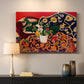 Canvas art print detailing a stylized composition of fruit and tableware, mounted in a softly lit interior space
