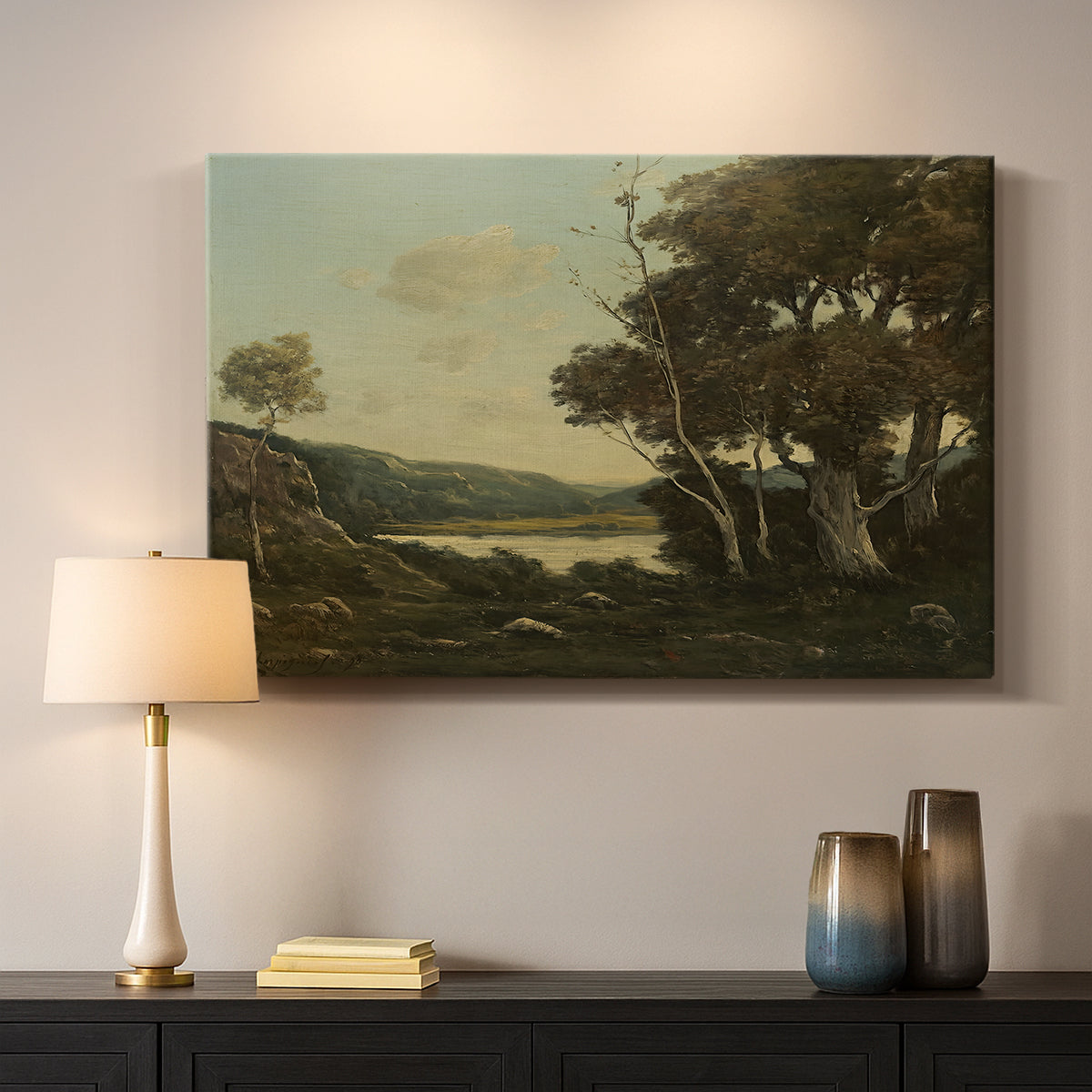 Canvas art print detailing a tranquil countryside view with soft atmospheric tones, mounted in a softly lit interior space