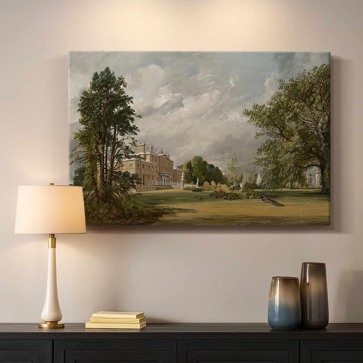 Canvas art print detailing a countryside view with house and vegetation, mounted in a softly lit interior space