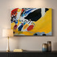 Canvas art print detailing an abstract depiction of concert atmosphere using color emphasis, mounted in a softly lit interior space