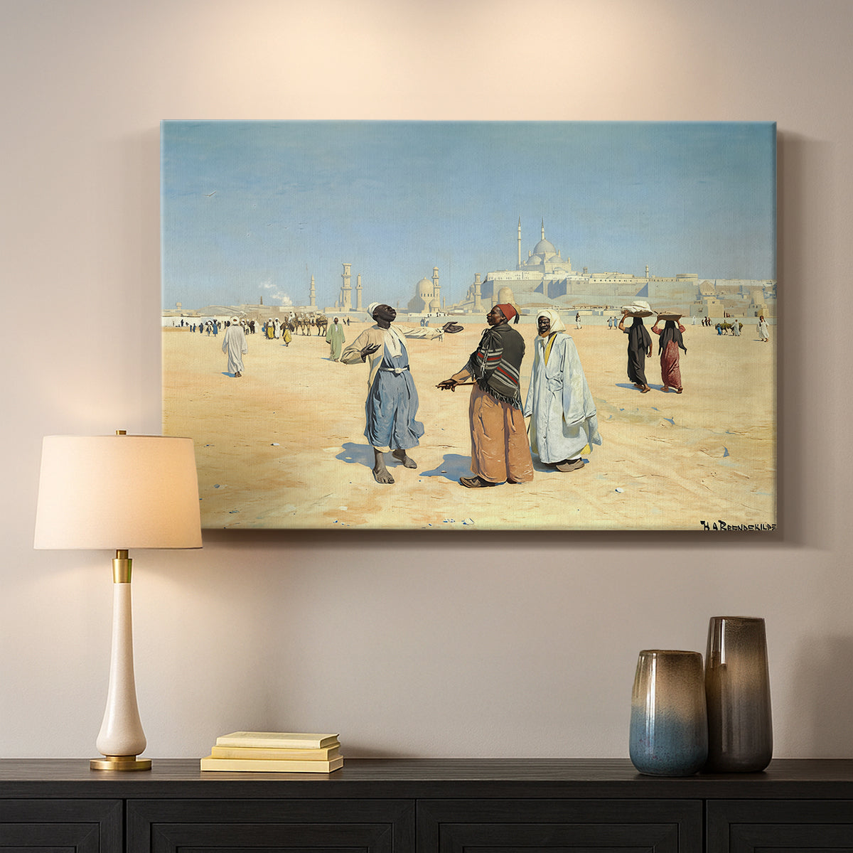 Canvas art print detailing a cultural landscape with desert foreground and historic structures, mounted in a softly lit interior space