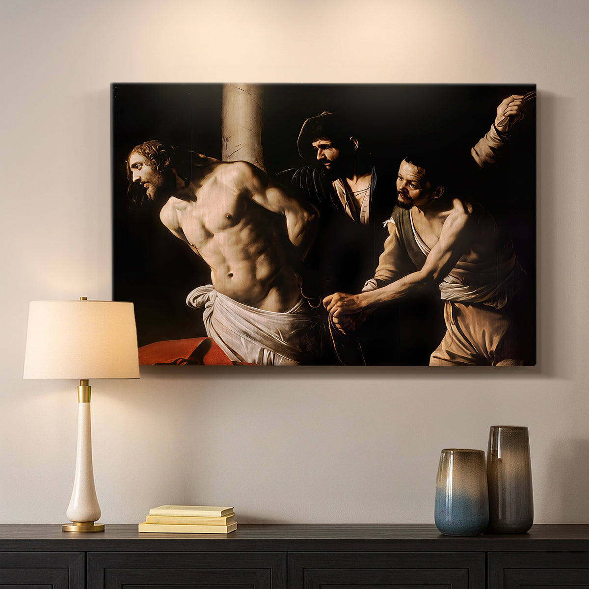 Canvas art print detailing an intense Baroque scene of suffering with strong light and shadow, mounted in a softly lit interior space