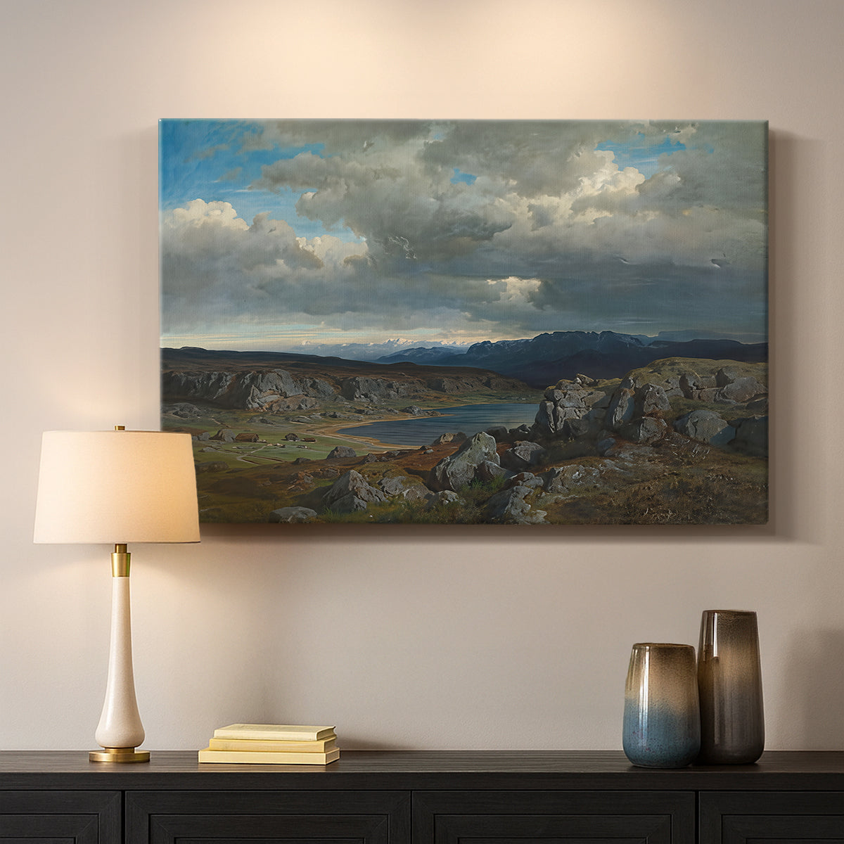 Canvas art print detailing a dramatic landscape with elevation and open sky, mounted in a softly lit interior space
