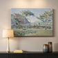 Canvas art print detailing a landscape with village and meadow, mounted in a softly lit interior space