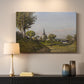 Canvas art print detailing a pastoral view with church structure in natural setting, mounted in a softly lit interior space