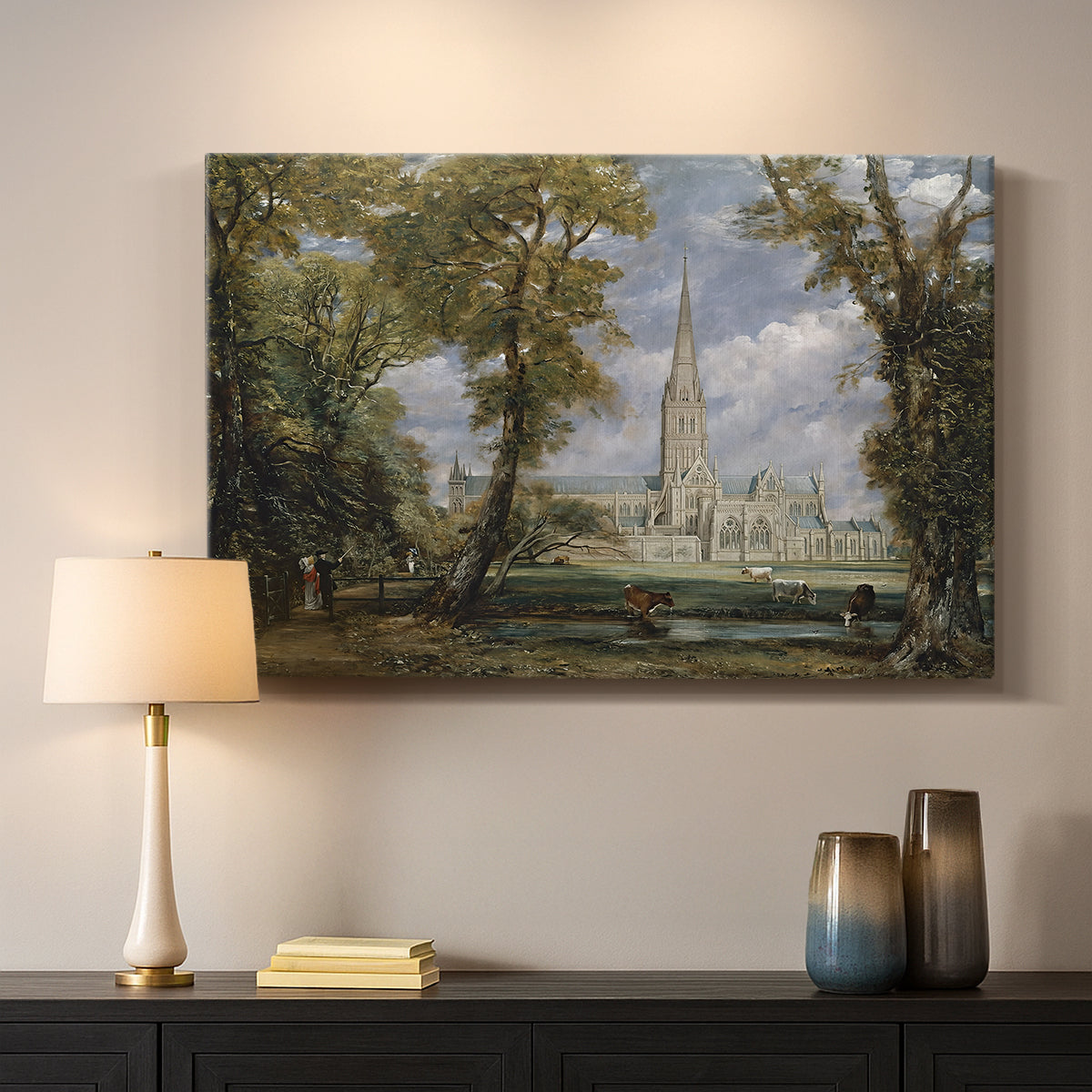 Canvas art print detailing a pastoral setting with cathedral, mounted in a softly lit interior space