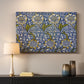 Canvas art print detailing a decorative composition with layered natural motifs and symmetry, mounted in a softly lit interior space