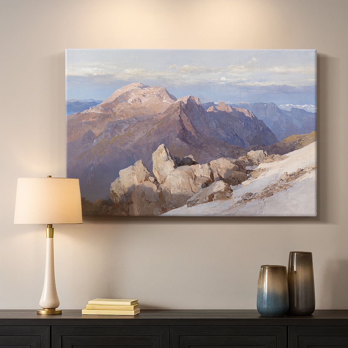 Canvas art print detailing an expansive mountainous landscape with natural depth, mounted in a softly lit interior space