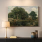 Canvas art print detailing a tranquil forest setting with atmospheric light, mounted in a softly lit interior space