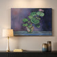 Canvas art print detailing a simple still life featuring a potted geranium, mounted in a softly lit interior space