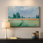 Canvas art print detailing a serene rural scene with textured wheat under natural light, mounted in a softly lit interior space