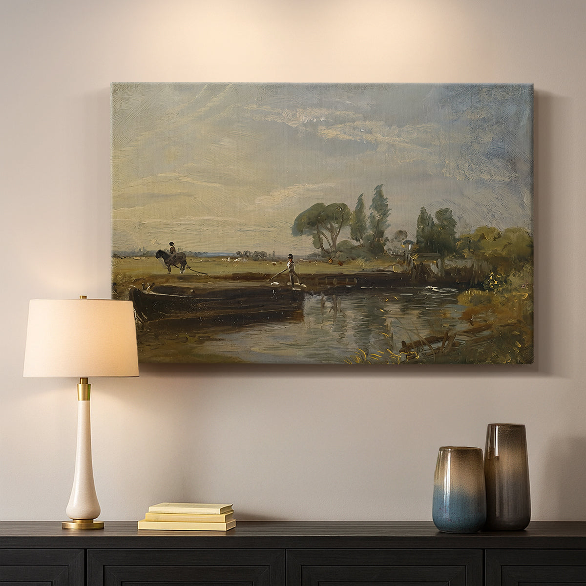 Canvas art print detailing a countryside view with barge and waterway, mounted in a softly lit interior space