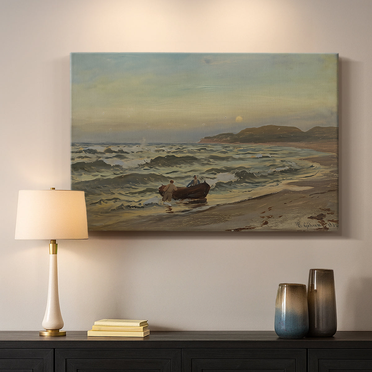 Canvas art print detailing a dramatic coastal weather scene with churning waves, mounted in a softly lit interior space