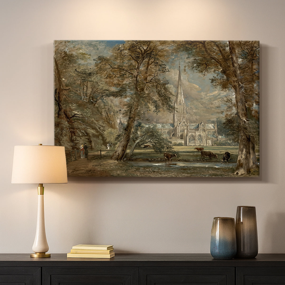 Canvas art print detailing a landscape featuring cathedral and greenery, mounted in a softly lit interior space