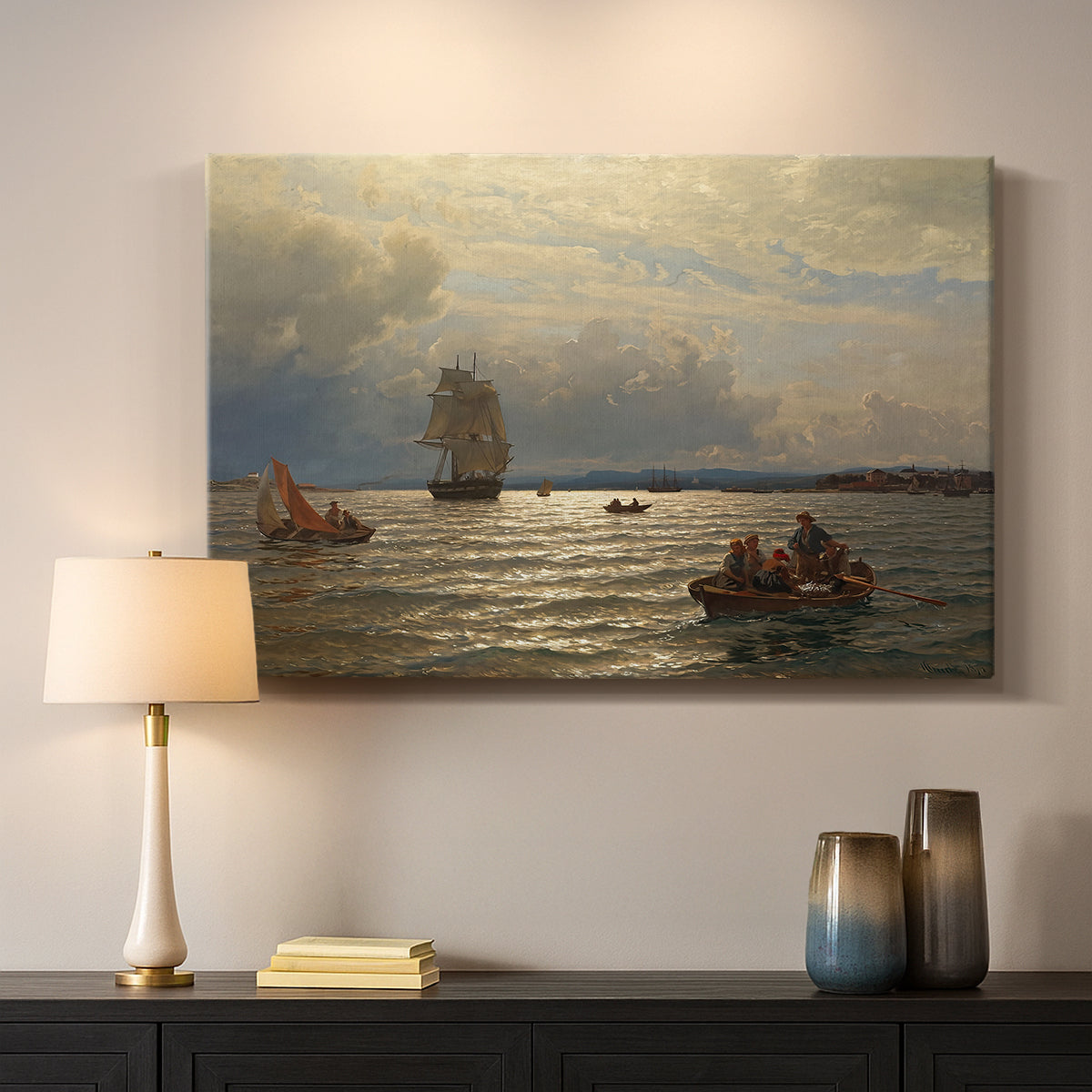 Canvas art print detailing a scenic waterfront view with gentle sky and shoreline, mounted in a softly lit interior space