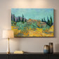 Canvas art print detailing a stylized rural setting with trees and structures, mounted in a softly lit interior space